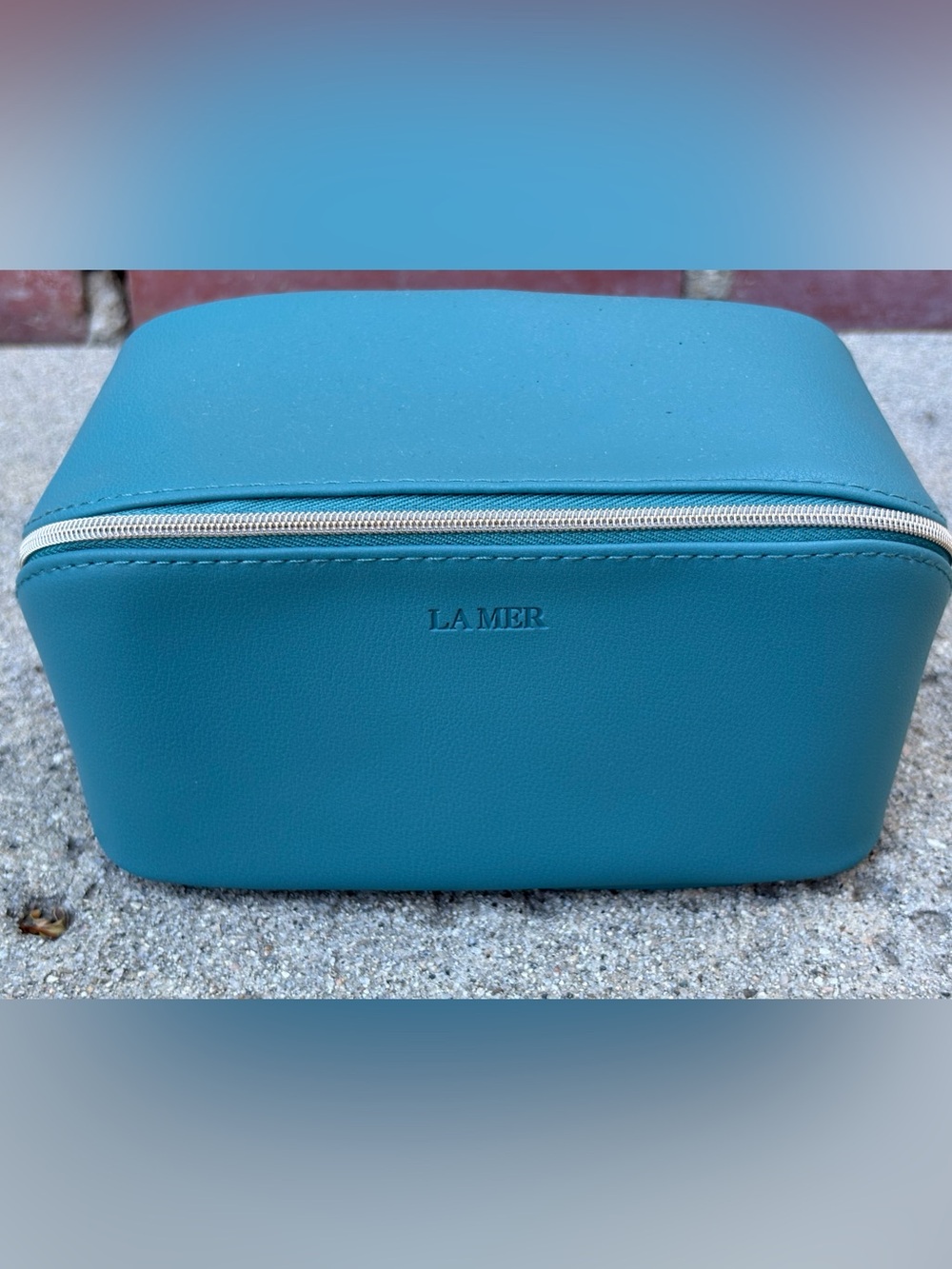 LA Mer Cosmetic Bag with travel size products